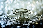 water drop splash nature ripples drip of feature stock photo