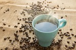 coffee beans mug cup of black hot drink stock photo