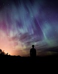 aurora borealis night sky northern man silhouette watching stock photo