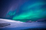 christmas background aurora northern lights borealis snow fields stock photo