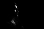 man portrait darkness dark profile male shadows expression stock photo