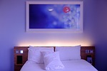 bedroom hotel room bed sheets beddings pillows interiors stock photo