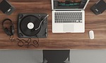 turntable computer workspace workstation flat lay laptop top stock photo