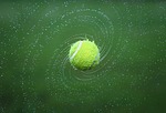 tennis ball spinning turning round splash wet water stock photo