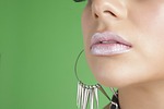 woman lips makeup model earrings lip gloss jewelry stock photo