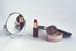 cosmetics powder lipstick cosmetic brush mirror makeup accessories stock photo