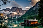 mountains lake house alps alpine calm waters water stock photo