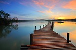 sunrise jetty lake pier sky horizon sunset dusk stock photo