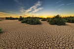 drought dehydrated clay floor earth cracked cracks dry stock photo