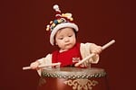 tet baby drum traditional costume chinese theme asian stock photo