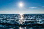 sea horizon sun sunlight sky ocean reflection seascape stock photo