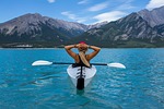 woman paddle kayak canoe kayaking canoeing relax water stock photo