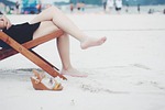 woman beach chair feet female barefoot girl lady stock photo