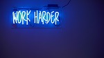 work harder blue motivation neon lights sign text stock photo
