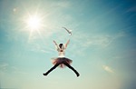 child costume fairy fly girl heaven jump sunlight stock photo
