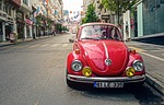 automotive volkswagen beetle car city classic old pavement stock photo