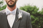 groom beard bow tie brooch fashion formal coat stock photo