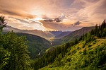 mountains trees sky clouds mountainous mountain ranges landscape stock photo