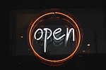 open illuminated light neon sign entry signage stock photo