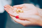 glitters hands macro shiny confetti golden stars female stock photo