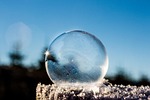 frozen bubble soap winter sunbeam sun nature landscape stock photo