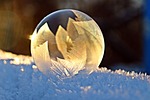 soap bubble nature snow winter frozen iced close stock photo