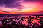 sunset rocks beach dusk twilight horizon afterglow nature stock photo
