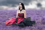 gothic woman dress costume surreal makeup female cosmetics stock photo