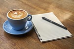 coffee pen notebook open empty caffeine cup cafe stock photo
