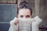 woman knitwear eyes face head hairstyle brunette girl stock photo
