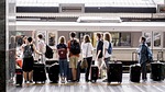 station crowd travel luggage stock photo