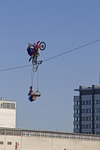 high-wire artist motorcycle rope man woman brave heaven stock photo