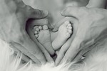 infant feet father mother small child toes baby stock photo