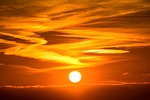 sun sunset setting evening atmosphere sky clouds heaven stock photo