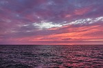 sunset baltic sea heaven ocean multicoloured purple dramatic stock photo