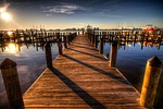 boardwalk pier harbor walkway sunset seaside sea ocean stock photo