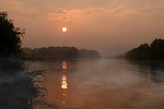 sunrise water the haze reflex red sun morning stock photo