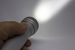 flashlight hand led light bright shining stock photo