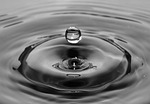 water drop ripple waves liquid nature closeup monochrome stock photo