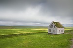 iceland house landscape nature clouds countryside old grass stock photo