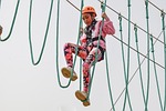 adventure park ropes girl climb courage fun high stock photo