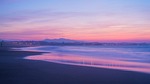 purple beach sunset new zealand sea nature water stock photo