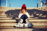 kid roller skates stairs girl child childhood summer stock photo