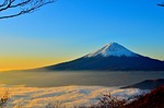 mountain volcano peak summit countryside sea of clouds stock photo