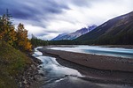 mountains landscape river nature sky clouds hiking meadow stock photo