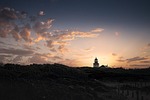lighthouse sunrise sky landscape nature clouds light dusk stock photo