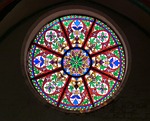 church window rosette stained glass art coloured light stock photo