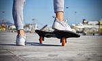 skateboard feet shoes guy skating active wheels outdoors stock photo