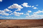 field land clouds sky horizon agriculture plowing cloudy stock photo