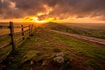 hill wooden fence sunset sunrise ridge peak stone stock photo